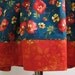 Girls dress/jumper Size 5 Autumn colors on Teal blue background