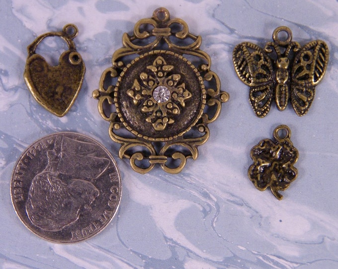 Set of Antique Brass Metal Charms- Four Leaf Clover, Locket, Butterfly, Medallion