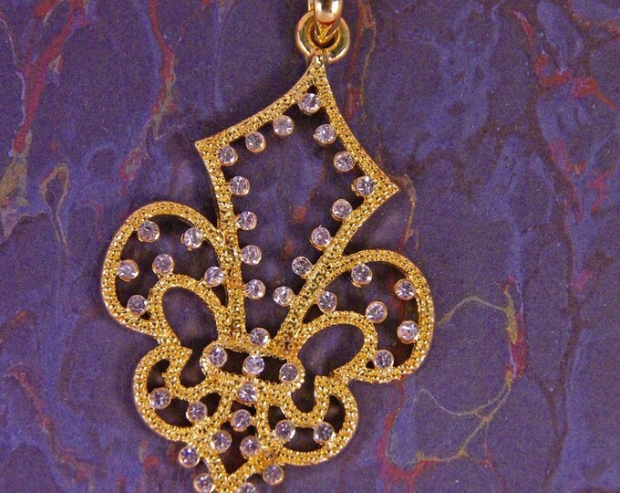 Cut Out Gold-tone Fleur de Lis Pendant with Tiny Rhinestone Accents