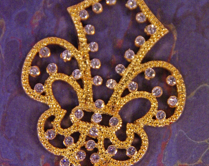 Cut Out Gold-tone Fleur de Lis Pendant with Tiny Rhinestone Accents