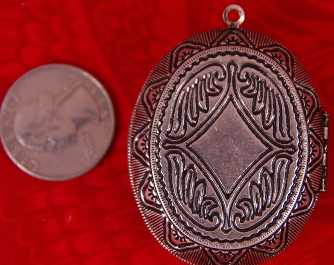 Large Antique Silver-tone Locket with Zebra Pattern Inset and Heart Cut-Out