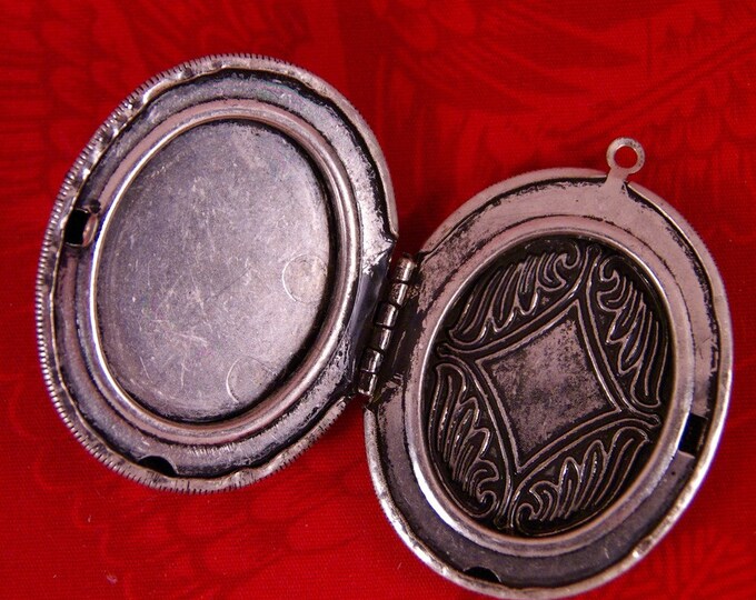 Large Antique Silver-tone Locket with Zebra Pattern Inset and Heart Cut-Out