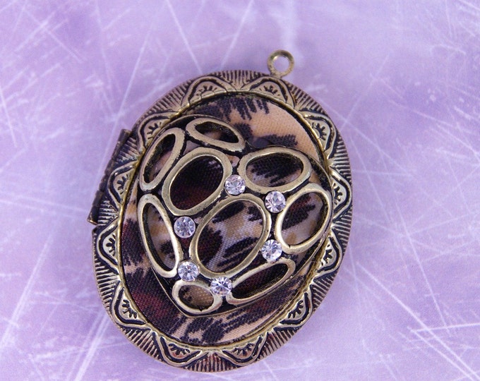 Large Antique Gold-tone Locket with Leopard Pattern Inset and Heart Cut-Out