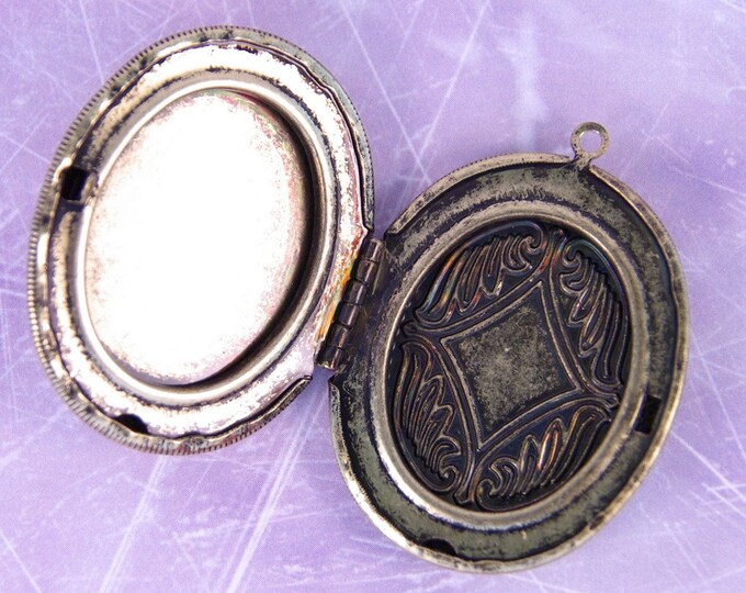 Large Antique Gold-tone Locket with Leopard Pattern Inset and Heart Cut-Out