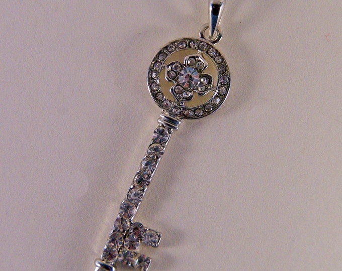 Rhinestone Encrusted Skeleton Key with Floral Motif Top Pendant