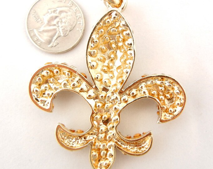 Gold-tone Fleur de Lis Pendant Encrusted with Rhinestones