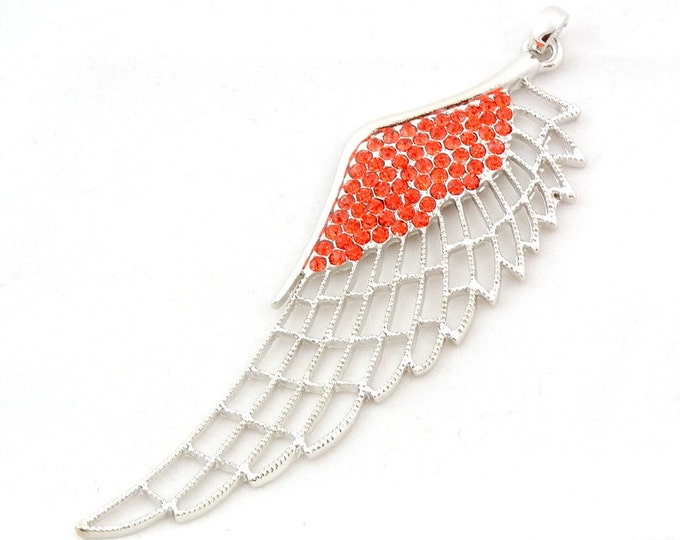 Large Silver-tone Cut-out Wing Pendant with Siam Red Rhinestone