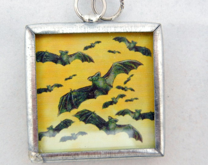 One Bat Charm in Metal Frame Under Glass