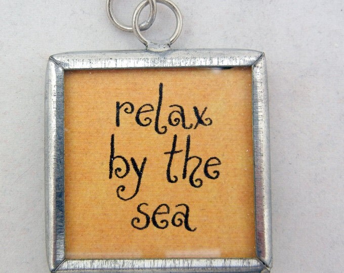 Relax by the Sea Charm in Metal Frame Under Glass