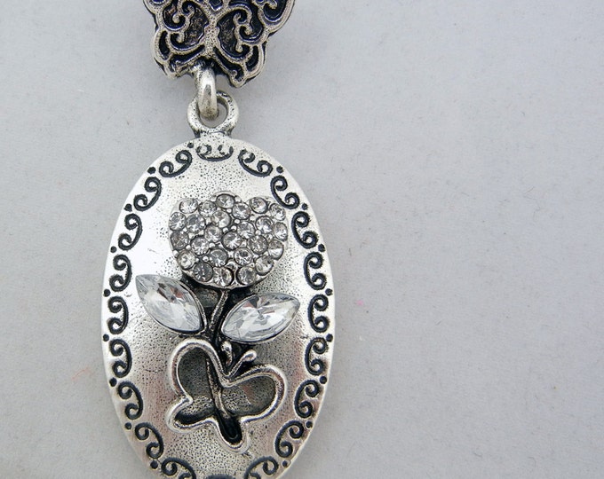 Antique Silver-tone Floral and Butterfly Theme Pendant with Rhinestone Accents