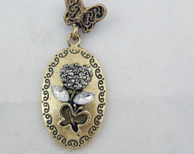 Antique Gold-tone Floral and Butterfly Theme Pendant with Rhinestone Accents