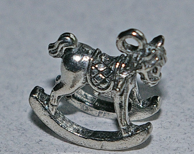 Pair of Pewter Rocking Horses