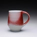 porcelain mug - coffee cup with flashing red and turquoise celadon glazes