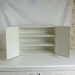 Vintage industrial metal cabinet can be mounted on the wall