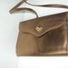 Classy vintage 80s bronze,metallic color, patent leather purse.Made by Chateau.