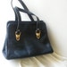Luxurious vintage 50s genuine leather forest green hand bag. Made by Croskopf''s.