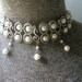 Classy vintage 80s white pearl adjustable collar necklace, framed with textured silver tone metal.