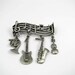 Loves Music Loves to Dance brooch by Jonette