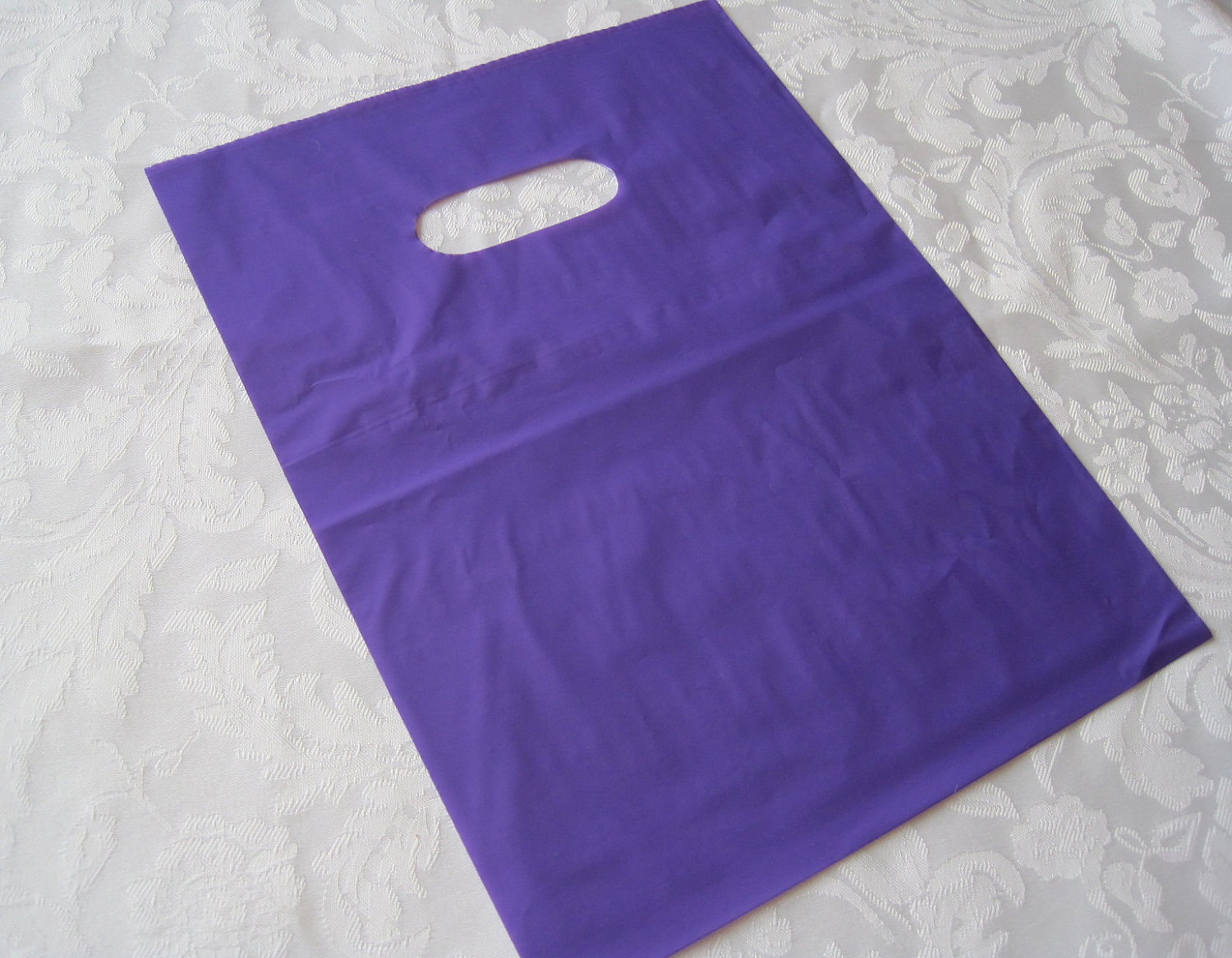 50-purple-plastic-gift-bags-retail-merchandise-bags-by-jetjewels