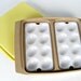vintage Tupperware tan deviled egg carrier with yellow lid