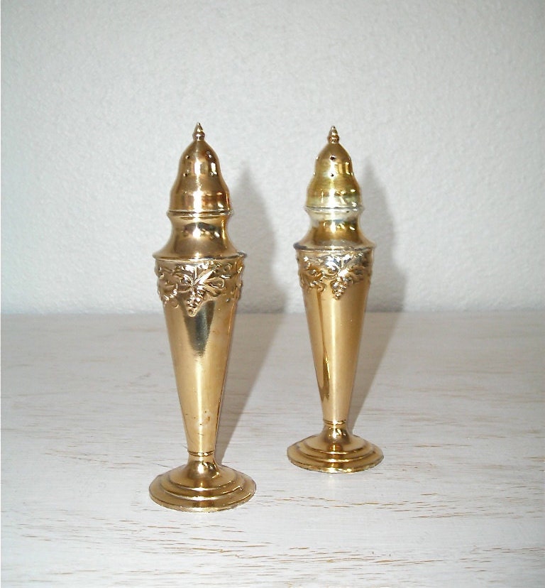 Gold Salt And Pepper Shakers With Silver Showing Through