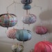 Fun pinks, greens, stripes, bunnies in a whimsical hanging mobile.