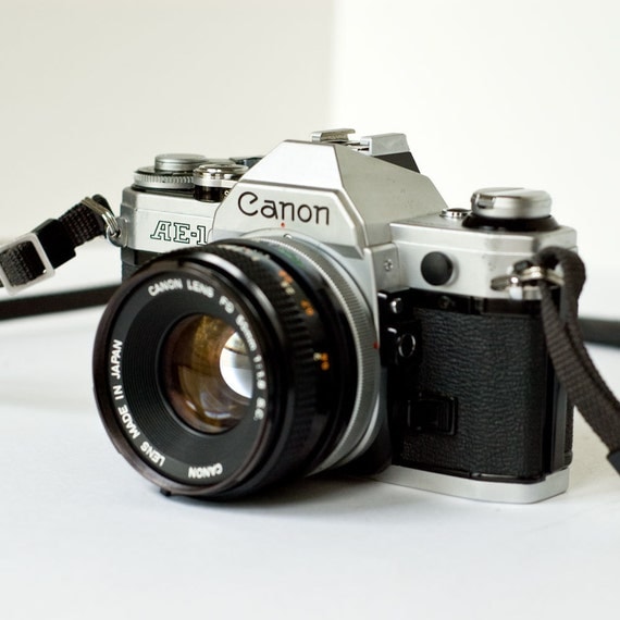 1980s Canon AE1 35mm SLR camera with 50mm f1.8 lens