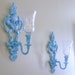 upcylced elegant whimsy wall sconces with glass votives