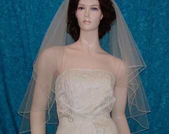 Two Tier Fingertip Bridal Wedding Veil Center Gathered finished with a delicate pencil edge.