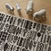 totem - hand screenprinted fabric in coal black on oatmeal