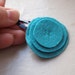 teal blue with blue stitch center and sewn onto a snap-style navy blue clip. merino wool felt. handsewn and hand cut.