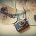 Traveler. Nostalgic honey crystal filled camera pendant with a hand stamped antiqued brass tag necklace