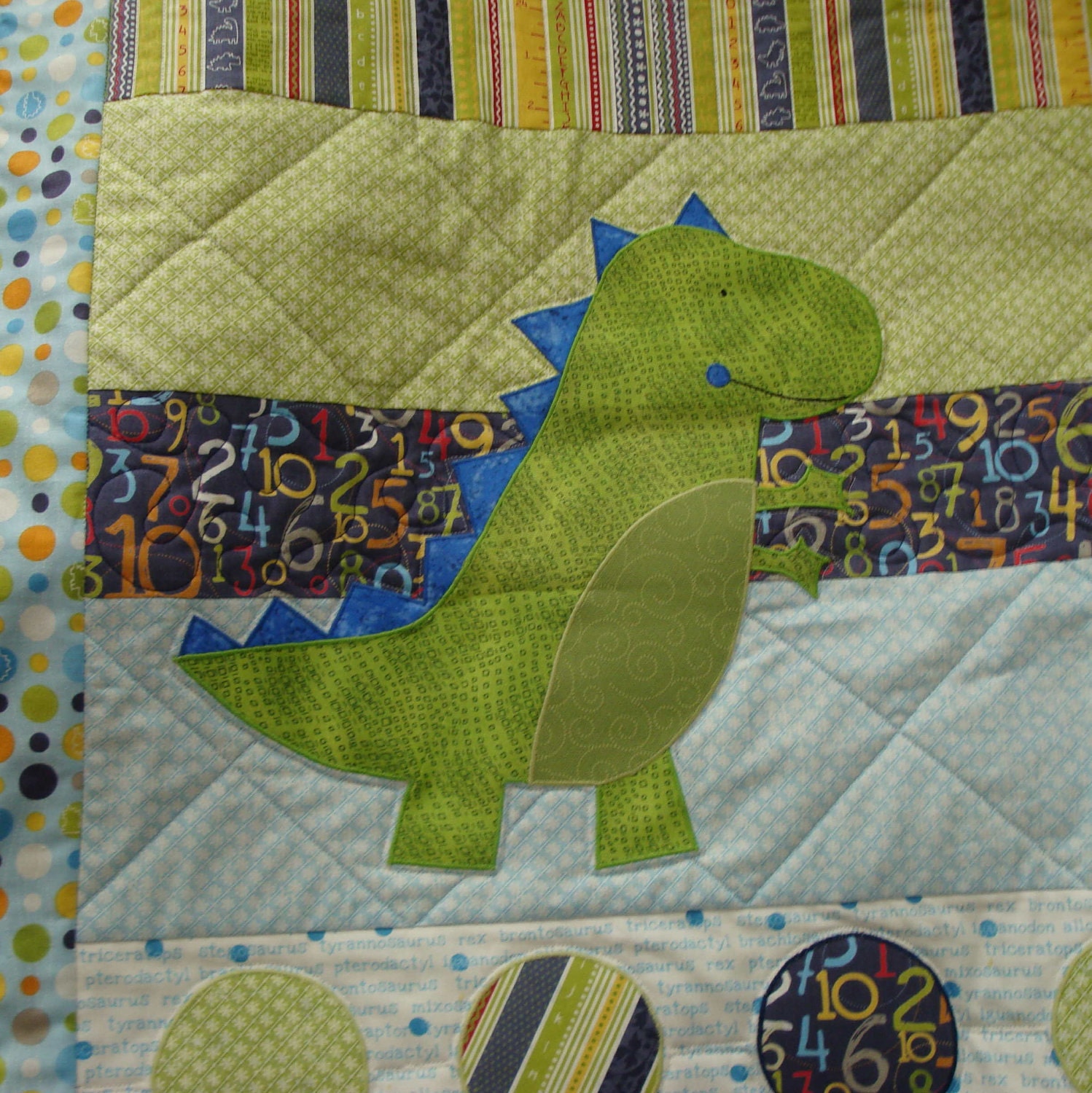 handmade-baby-quilt-dinosaur-lap-quilt-babysaurus-on-blue