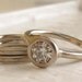 Simple Solitaire with matching bands white gold and moissanite