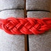 vintage braided belt in red with gold clasp