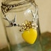 a delicate tattoo - vintage enamel flower and yellow glass heart necklace on brass chain