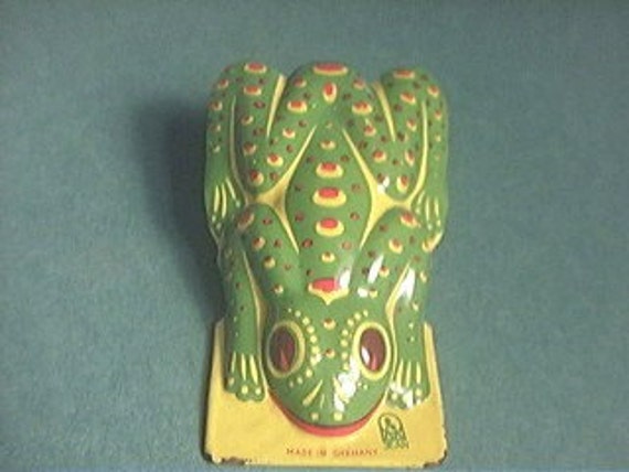 tin clicker toy