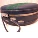 round green tree suitcase