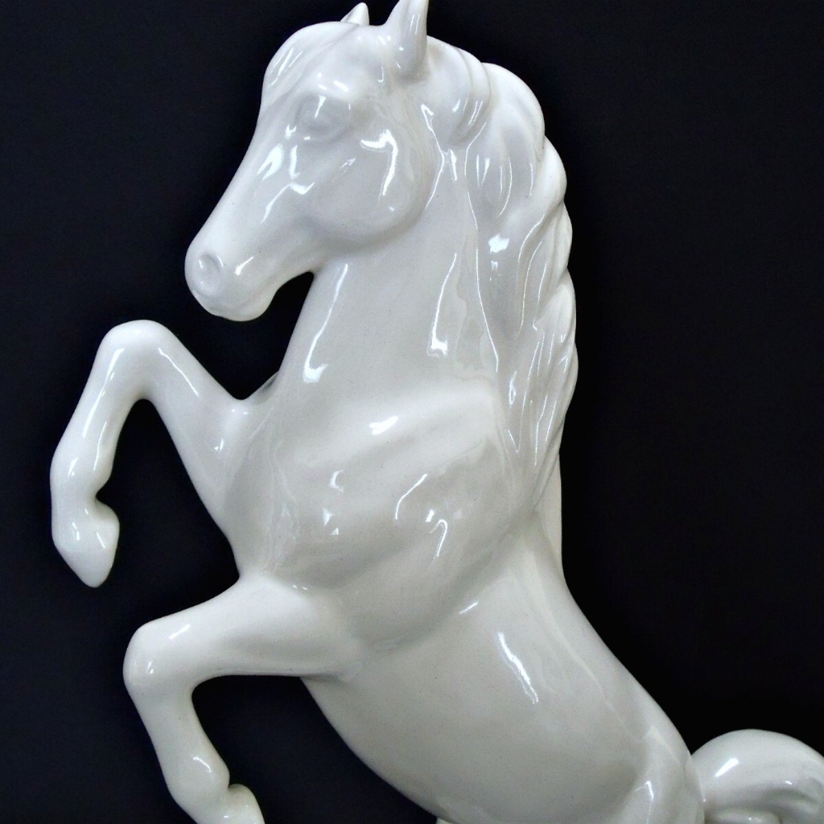 white ceramic horse statue