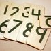 2 sets of Sandpaper Numbers 0-10 mounted on birch wood