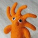 RESERVED for Simon: Small beastie or monster with five horns, needle felted in bright carrot orange