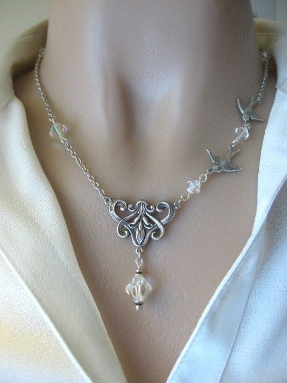 Items similar to Swallows and Sparkling Crystals Necklace in Silver on Etsy