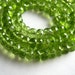 Large Peridot Faceted Rondelles, 6x4mm. Packet of 6 .. (11PER)