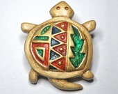 Turtle brooch with southwestern designs.