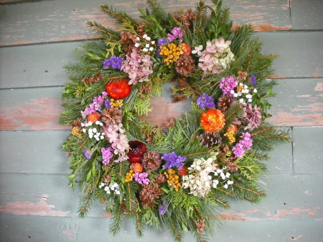 Fresh assorted evergreen wreath. 16" size, made with Pine, Balsam, Boxwood, and cedar. Decorated with colorful dried flowers.
