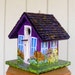 Birdhouse Handcrafted and Hand Painted Purple with a lot of Flowers