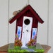 Birdhouse Blessings has Handcrafted and Hand Painted a Cranberry Red Birdhouse with lots of Flowers