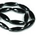 Glamorous Black ONYX faceted Rice shape beads large 30mm x 10mm elongated olive - 8 inch strand