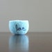 reserved for angela -felted bowl - felted wool bowl in aquamarine blue wool with navy blue cotton embroidered word "love"