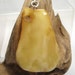 Pendant, handmade of a Baltic amber. (EK36)